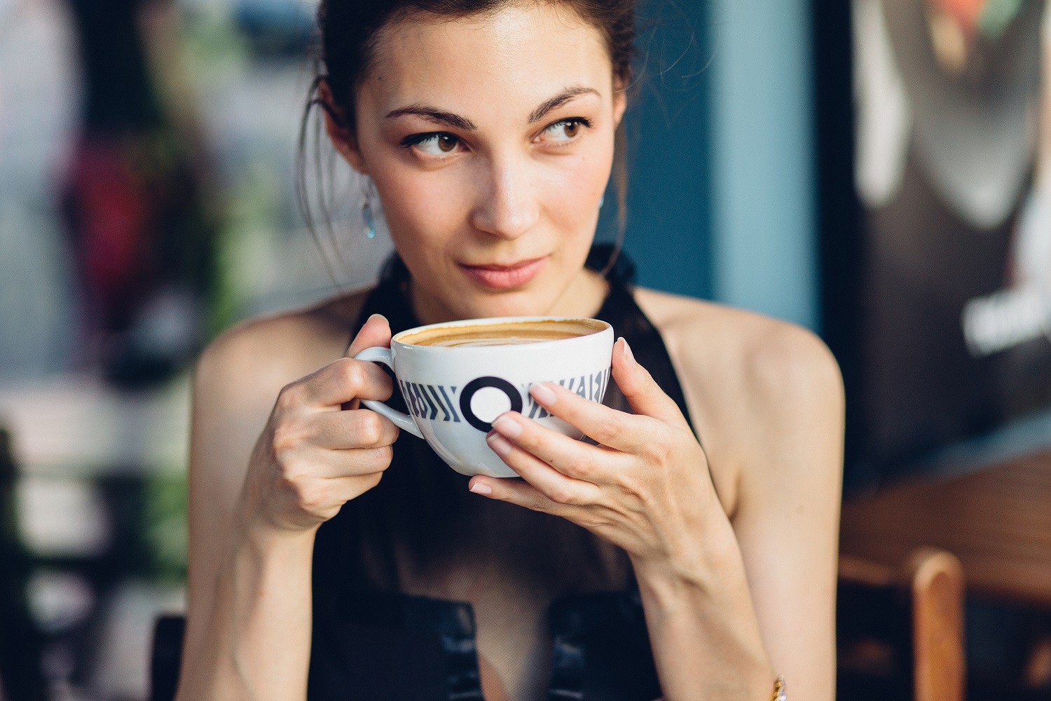 Pretty woman drinking coffee.